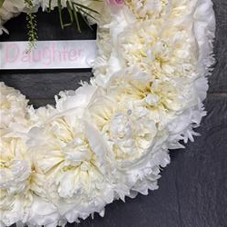 Name on a ribbon for funeral tributes
