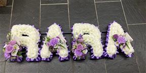based floral letter funeral tribute Camborne